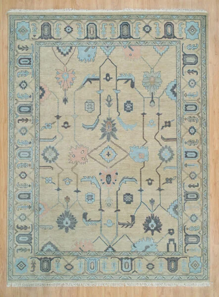 Hand-knotted wool oushak rug with a warm sand field, wide aqua border, and sparse airy palmette, diamond, and angular-vine motifs in grey and aqua with generous negative space.