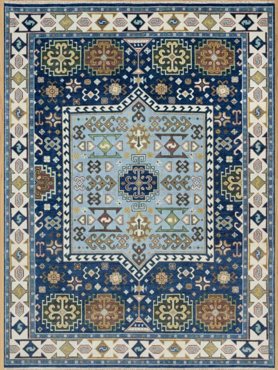 Hand-knotted wool Oushak rug with deep navy field, ivory border, and intricate geometric medallion in blue, gold, and brown.