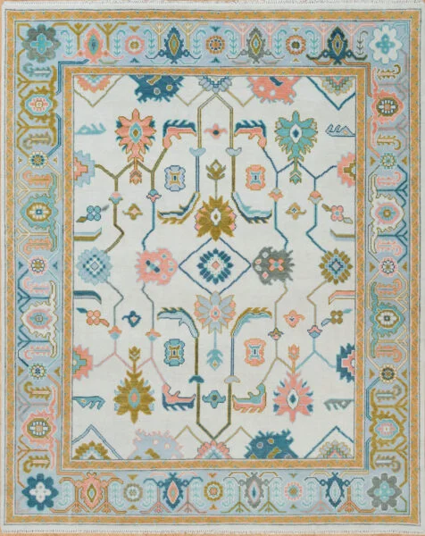Hand-knotted wool Oushak rug with ivory field, teal and gold border, and floral palmettes in teal, peach, gold, and blue.