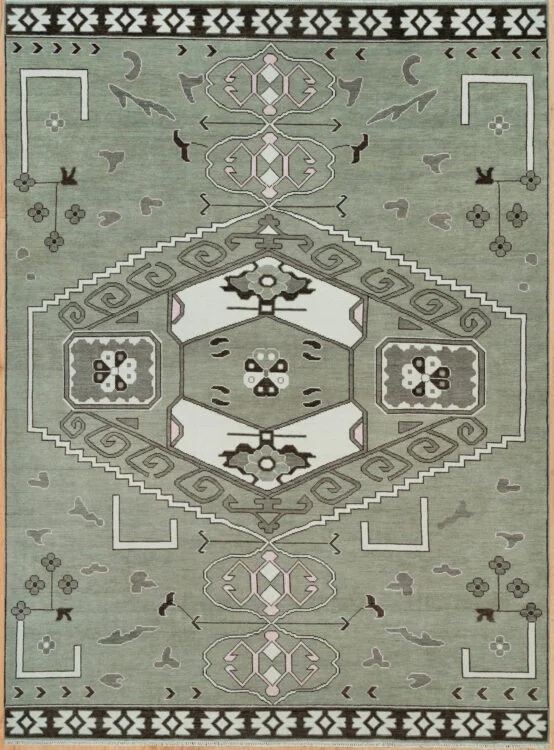 Hand-knotted modern Oushak wool rug with a sage green field, large central hexagonal medallion, stepped geometric motifs and a dark charcoal border.