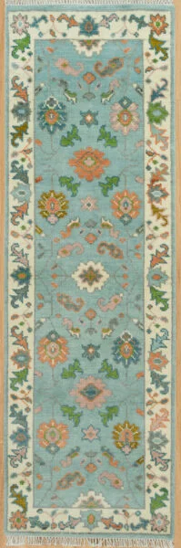 Hand-knotted modern Oushak wool runner rug with an aqua field, coral rosettes and green leaf motifs, and an ivory floral border.