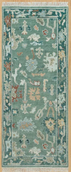Hand-knotted modern Oushak wool runner with a dusty teal field, muted ivory and rust palmettes, and a deeper teal border.