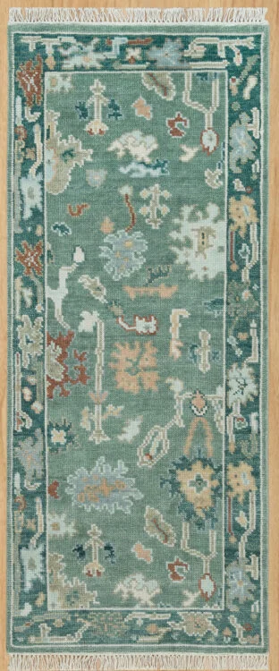 Hand-knotted modern Oushak wool runner with a dusty teal field, muted ivory and rust palmettes, and a deeper teal border.