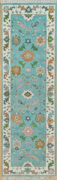 Hand-knotted modern Oushak wool runner with an aqua field, coral rosettes and green leaf motifs, and an ivory floral border.