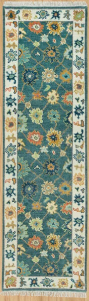 Hand-knotted modern Oushak wool runner with a rich teal field, dense gold, sage and ivory floral rosettes in a diagonal lattice, and an ivory border.