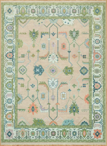 Hand-knotted wool oushak rug with a warm beige field, wide ivory-green border, and balanced medium-scale palmettes, rosettes, and tulips in green, teal, coral, and blue.