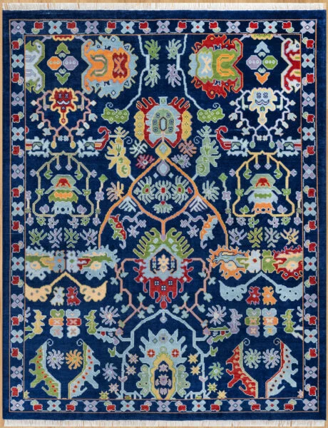 Hand-knotted wool oushak rug with a deep navy field, wide navy-red border, and dense medium-scale palmettes, rosettes, and angular vines in red, green, gold, blue, and orange.