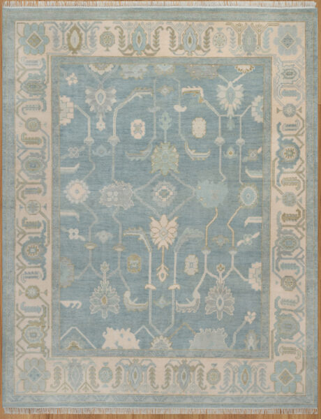 Hand-knotted wool oushak rug (8x10) with a soft blue field, wide ivory border, and balanced medium-scale palmettes and rosettes in ivory, sage, olive, and gold.