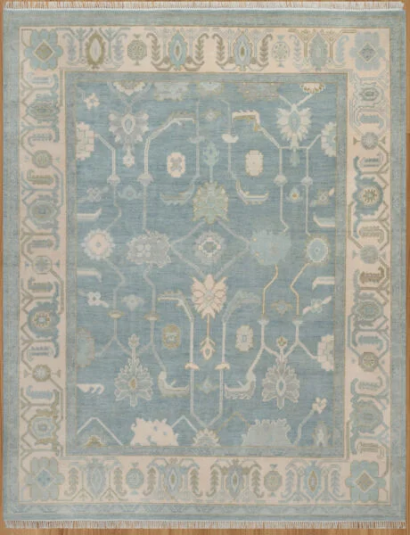 Hand-knotted wool oushak rug (8x10) with a soft blue field, wide ivory border, and balanced medium-scale palmettes and rosettes in ivory, sage, olive, and gold.