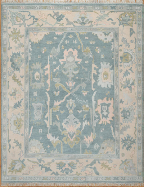 Hand-knotted wool oushak rug (8x10) with a mid-blue field, wide ivory border, and balanced large-scale palmettes and rosettes in ivory, sage, olive, and blush.
